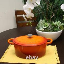 7-Quart Enameled Orange Sunburst Cast Iron Dutch Oven with Lid