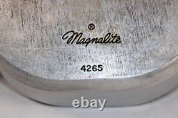 Cocotte en aluminium Wagner Ware Magnalite 4265 pour rôtir la dinde avec couvercle et dessous de plat.