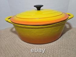 Cocotte ovale vintage en fonte avec couvercle, couleur jaune et orange. Taille 13 pouces.