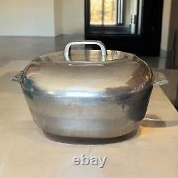 Vintage Wagner Ware Sidney O Magnalite 8qt 4265-P Roaster Dutch Oven With Lid translates to 'Cocotte rôtissoire vintage Wagner Ware Sidney O Magnalite 8qt 4265-P avec couvercle' in French.