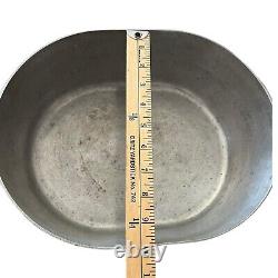 Vintage Wagner Ware Sidney O Magnalite 8qt 4265-P Roaster Dutch Oven With Lid translates to 'Cocotte rôtissoire vintage Wagner Ware Sidney O Magnalite 8qt 4265-P avec couvercle' in French.