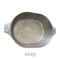 Vintage Wagner Ware Sidney O Magnalite 8qt 4265-P Roaster Dutch Oven With Lid translates to 'Cocotte rôtissoire vintage Wagner Ware Sidney O Magnalite 8qt 4265-P avec couvercle' in French.