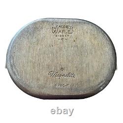 Vintage Wagner Ware Sidney O Magnalite 8qt 4265-P Roaster Dutch Oven With Lid translates to 'Cocotte rôtissoire vintage Wagner Ware Sidney O Magnalite 8qt 4265-P avec couvercle' in French.